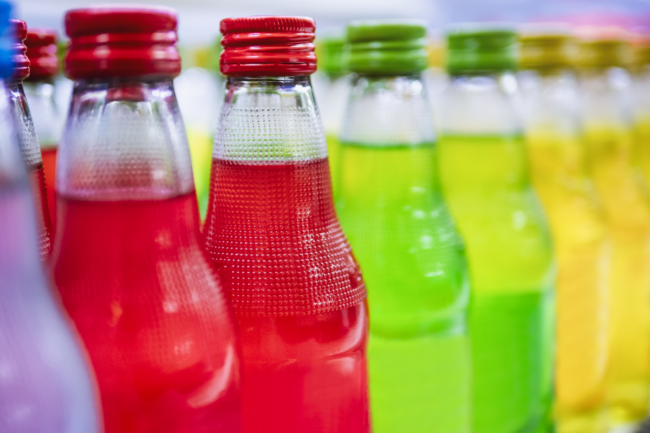 Soda bottles on supermarket shelf