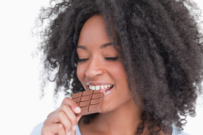 Woman eating chocolate