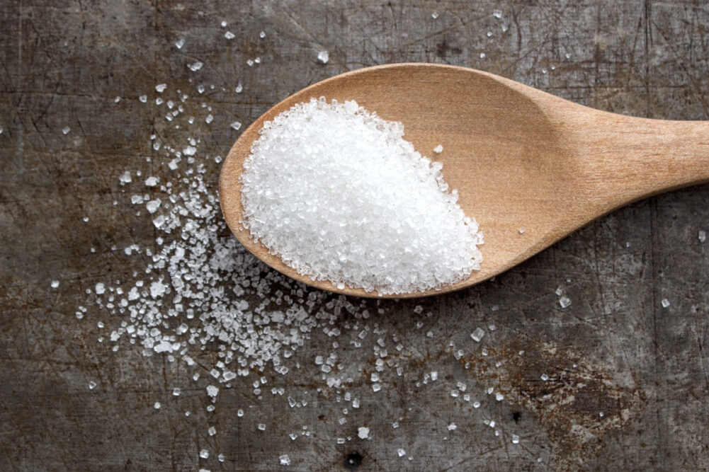 Sugar in a wooden spoon