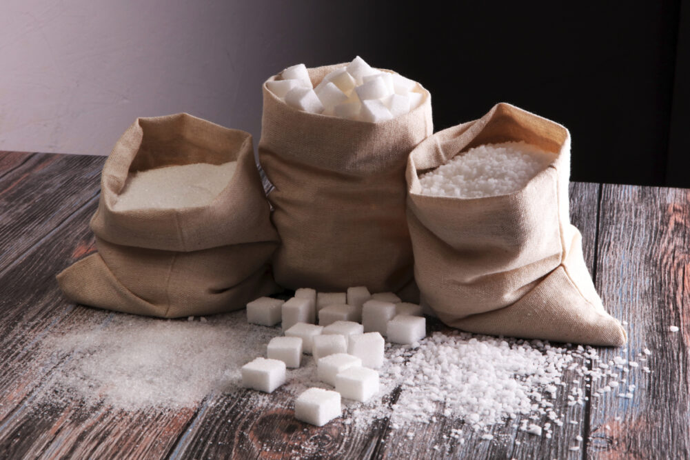 Three bags of sugar in various formats