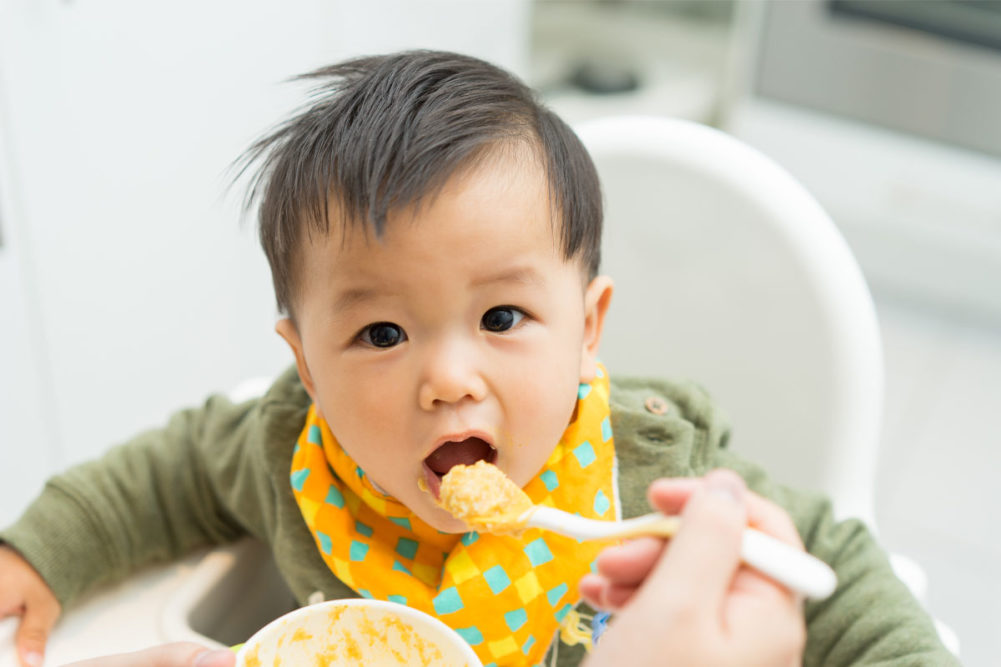 Baby eating baby food