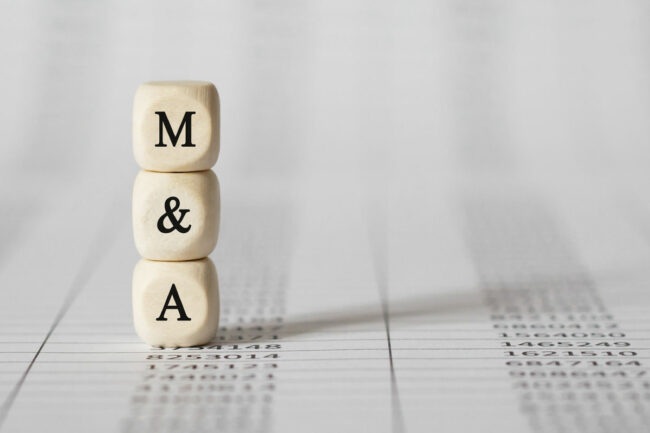 A wooden M and a wooden A for mergers and acquisitions