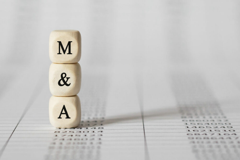 A wooden M and a wooden A for mergers and acquisitions