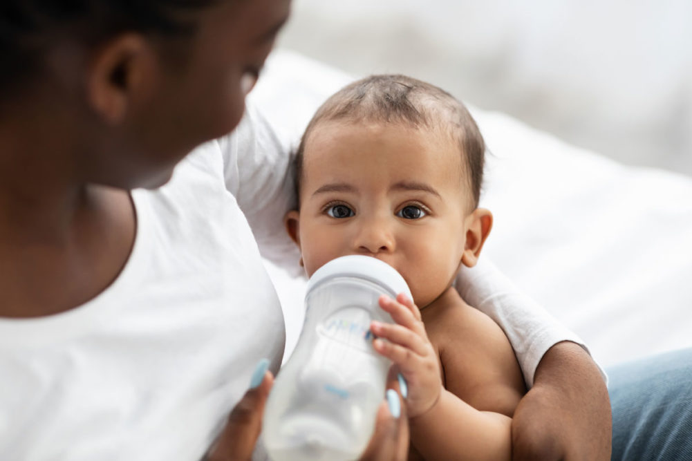 A baby drinking from a bottle