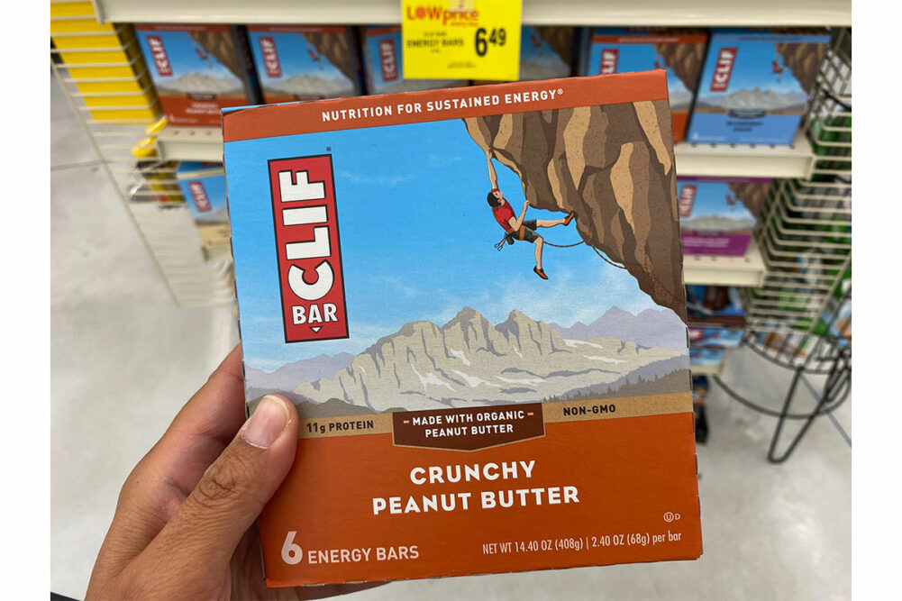 A person holding a Clif Bar box