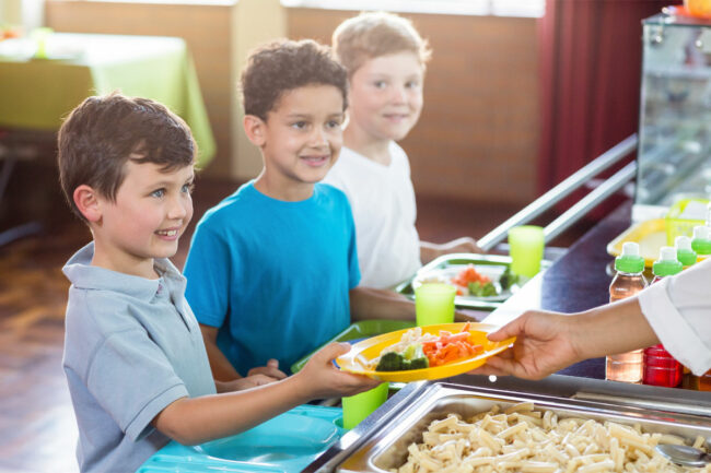 Children getting school lunch