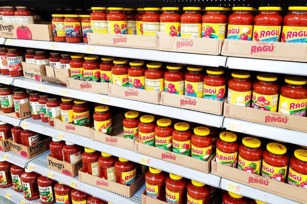 Ragu sauces lined on shelves.