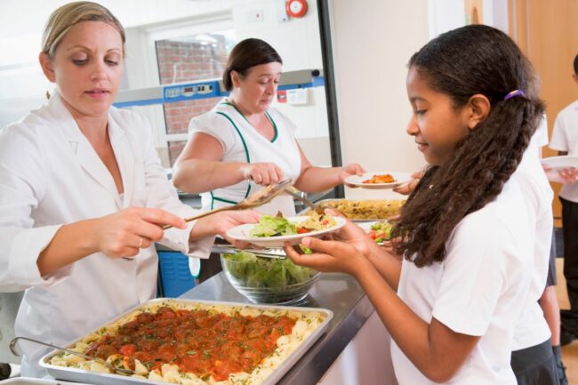 schoolgirl getting food